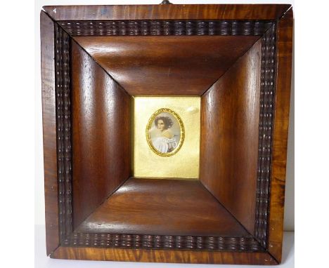A framed hand-painted portrait miniature of a lady