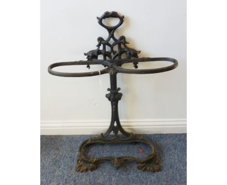 A black-painted cast-iron double umbrella/stick stand