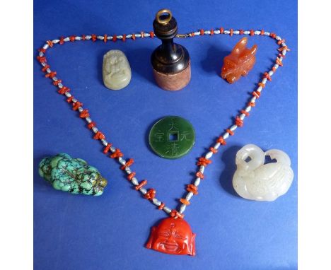 A collection of Asian objets d'art comprising a carved hardstone rabbit, a red coral and Biwa pearl Buddha necklace, a turquo