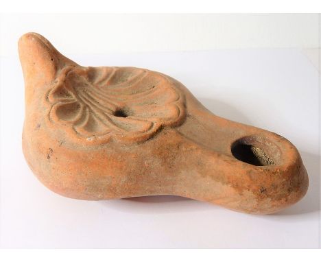 A Roman terracotta oil lamp, possibly 3rd/4th century