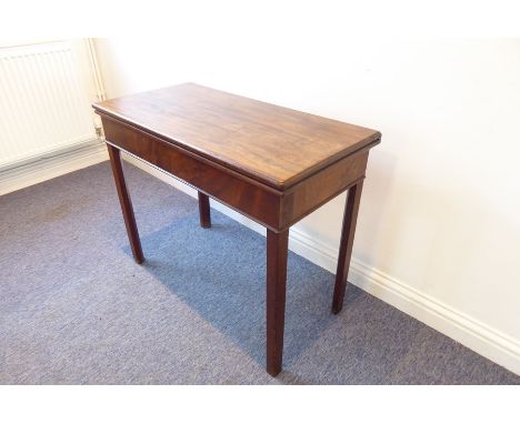 A George III period fold-over top mahogany card table raised on square chamfered legs (90.5cm wide)