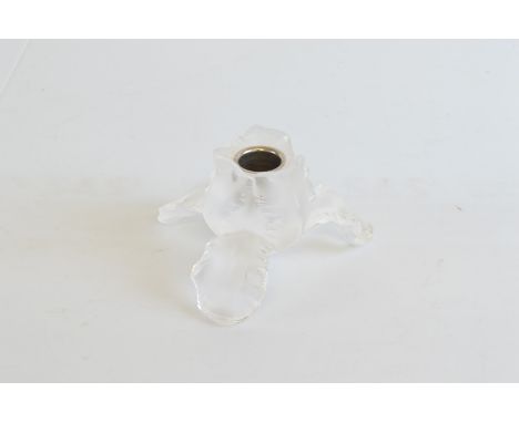 A contemporary Lalique glass candlestick, having three legs moulded as petals and petal sconce, chromed interior, etched sign
