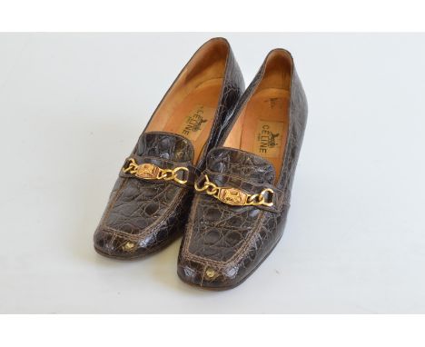 A pair of ladies Celine Paris shoes, the brown crocodile leather effect with gilt metal buckles size 38  