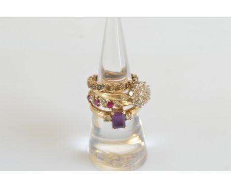 Four gem set 9ct gold rings, three size O, one size M, including a diamond cluster example, ruby and diamond, amethyst and cu