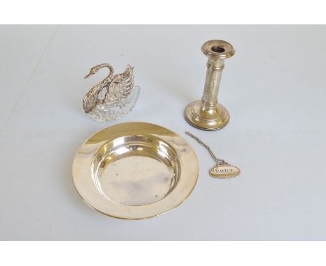 A George V silver bowl, of plain circular shape, Birmingham 1932, 180g together with a silver filled column candlestick, a wh