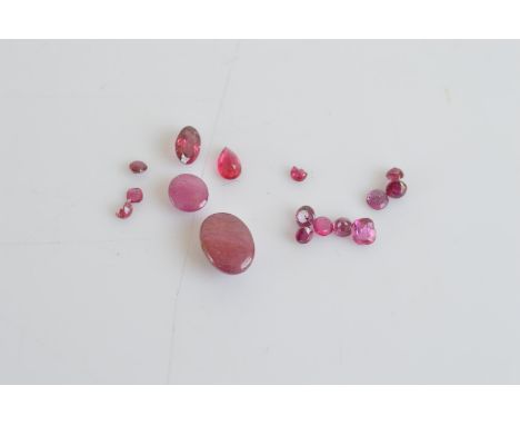 A quantity of loose corundum variety ruby, including cabochons, round cuts and ovals, 7.4ct