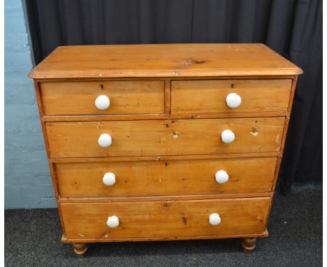 A 19th Century pine chest of drawers, having two short over three long drawers, on turned feet, ceramic handles, 101cm x 46cm