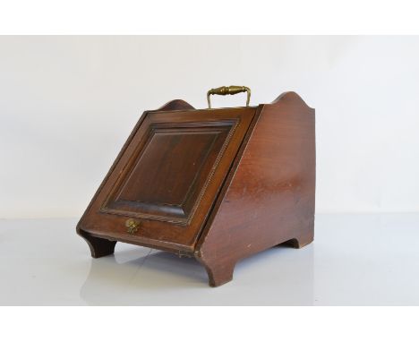 A late 19th Century walnut and brass coal scuttle, in the aesthetic taste, metal lining, lacking original shovel, 35cm wide x