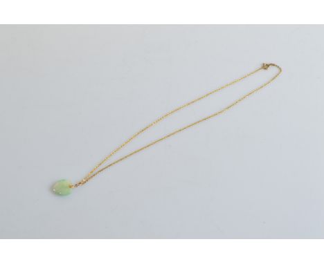 A jade heart shaped pendant, on a gilt metal chain, 23.5cm together