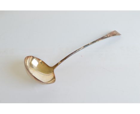 A George III silver old English pattern ladle, with armorial crest of armoured hand and broken flag, London 1801 by Thomas Wh