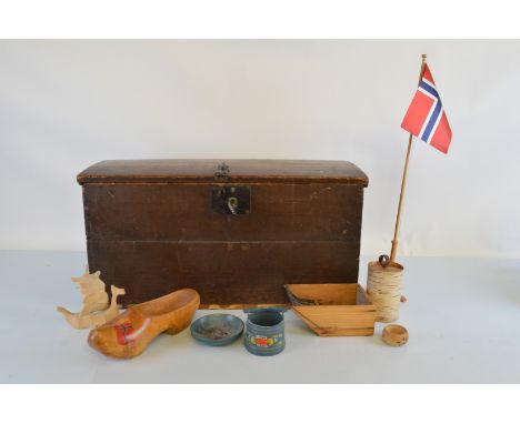 A Norwegian stained pine domed hinged trunk, 65cm wide x 32cm deep x 34cm high containing various wooden painted Norwegian wo
