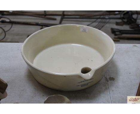 A large ceramic creamer by The Church Churn Co. of Halesham England