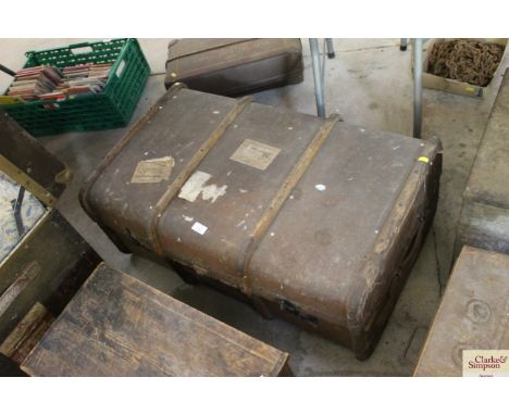 A canvas and wooden bound travelling trunk