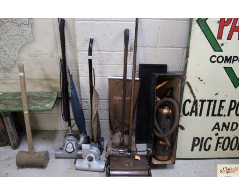 A quantity of vintage vacuum cleaners including GEC, Ewbank etc.