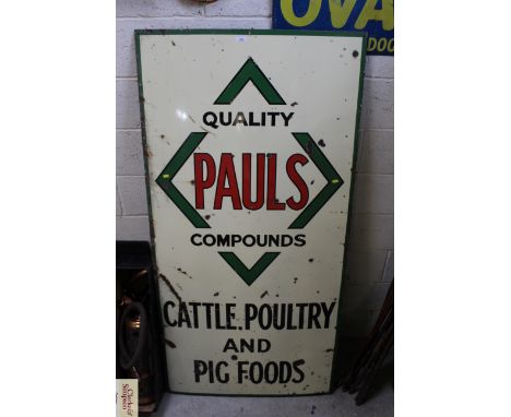 A "Paul's Compounds Cattle Poultry and Pig Foods" enamel advertising sign, approx. 72" x 36"