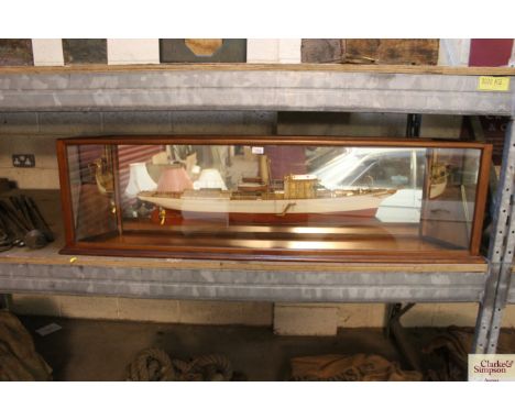 A half scale model of a vintage steam ship in mirrored glazed mahogany case
