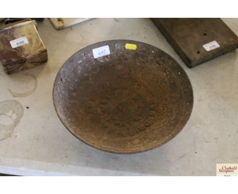 A vintage cast iron dog feeding bowl 
