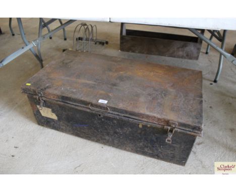 A large metal travelling trunk
