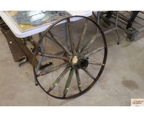 A vintage metal and wooden cartwheel 