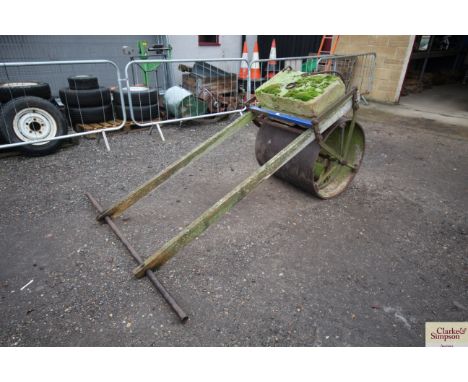 A vintage hand pushed cricket pitch roller with Yorkstone weight, approx. 32" wide x 32" dia.