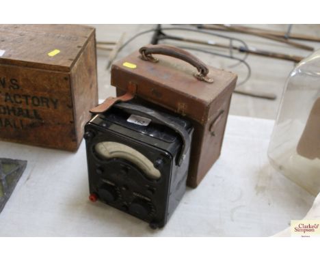 A vintage AVO meter with leather case
