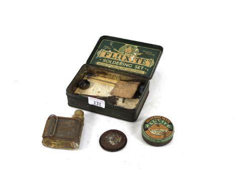 A vintage Fluxite soldering tin and contents 