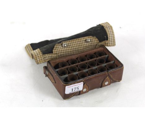 A vintage Rapid Mode cartridge loading box in leather mounted case