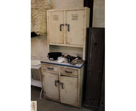 A vintage enamel kitchen cabinet 