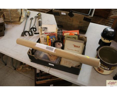 A box containing part of a tobacco jar, BSA and other instruction manuals, a tube containing two vintage calendars, a quantit
