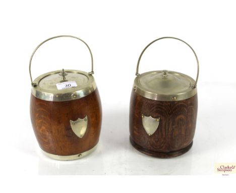 Two early oak biscuit barrels with ceramic inserts 