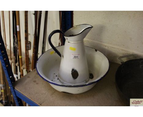 A small enamel jug and bowl