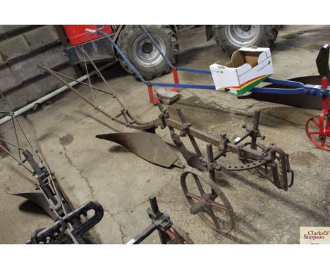 A vintage horse drawn plough