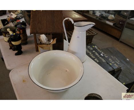 An enamel wash jug and bowl