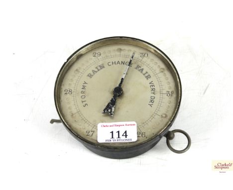 A small circular braille barometer 