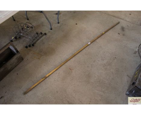 A brass tank fluid measuring stick