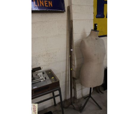 Metal and a wooden sheep dipping tools, a bamboo handled gaff and a wood borer 