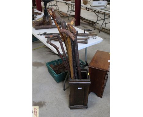 A wooden stick stand and a quantity of sticks 