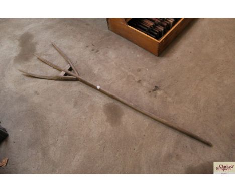 A vintage wooden three tine fork