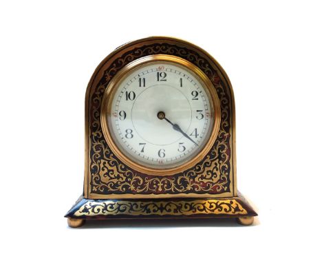 A French boulle work mantel clock, 19th century, the dome shaped case centred with a white enamel dial, on a plinth base and 