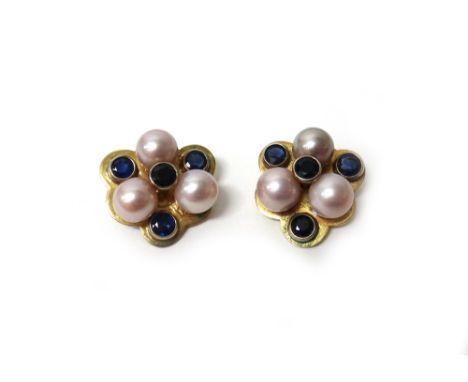 A pair of gold, cultured pearl and sapphire set earclips, each of trefoil form, mounted with three cultured pearls and with f
