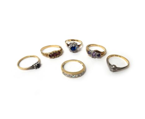 A gold and diamond set single stone ring, detailed 18 CT, a 9ct gold ring, mounted with a circular cut sapphire at the centre