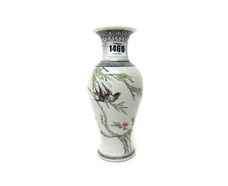 A Chinese porcelain famille-rose baluster vase, 20th century, painted with two birds in flight amongst flowering branches, th