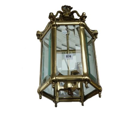 A brass hexagonal hall lantern, 20th century, with inset bevelled glass panels and an internal three light fitment, 49cm high