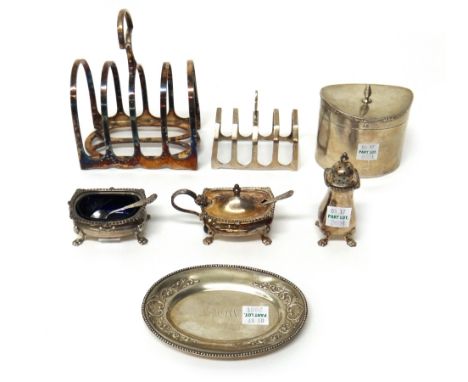 Silver, comprising; an oval hinge lidded tea caddy, Birmingham 1919, a five bar toast rack, Sheffield 1931, three condiments,