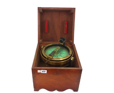 A brass gimble mounted ship's compass, early 20th century, with green dial plate and a mahogany travel box, 19cm diameter.