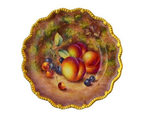 A Royal Worcester plate, 20th century, hand painted with fallen fruit by 'FREEMAN' within a gilt shaped border, black printed
