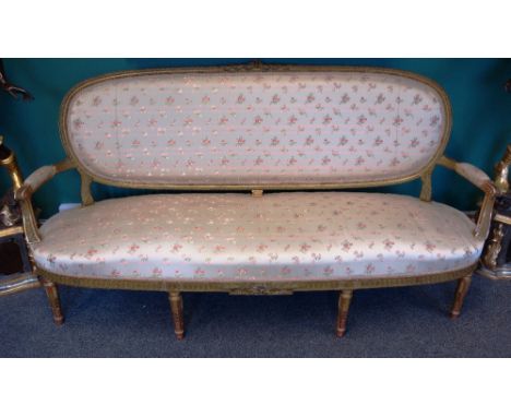 A Louis XVI style gilt framed sofa on tapering fluted supports, 190cm wide x 97cm high.  30