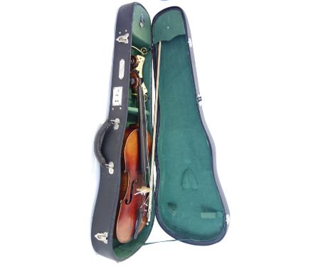 A German violin, interior paper label, reads 'Antonius Stradivarius Cremonensis Faciebat Anno 1727', with bow and hardcase. (