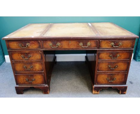 An 18th century style mahogany nine drawer pedestal desk on bracket feet, 137cm wide x 83cm deep. 9.1