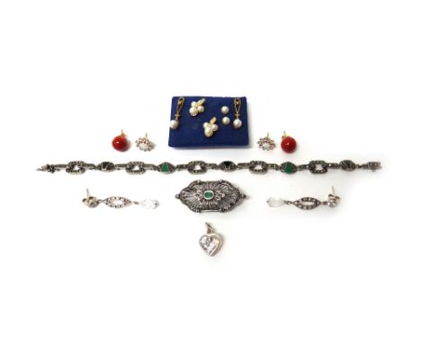 A marcasite, dyed green agate and black onyx bracelet, a silver, emerald and marcasite set brooch, in a pierced panel shaped 